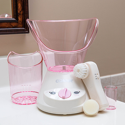 CONAIR<sup>&reg;</sup> Tru Glow<sup>&reg;</sup> Facial Sauna System/ Pink - Gently steam to open clogged pores and rejuvenate your skin. A narrow sinus cone helps clear nasal and sinus passages. There's a timer, automatic shutoff and a water cylinder for easy and accurate filling. Includes a wide facial steamer, narrow sinus cone, facial tool with gentle exfoliating brush and a sponge for applying moisturizer. 

