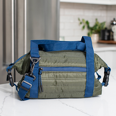 ONIVA<sup>&reg;</sup> Midday Washable Lunch Bag - This stylish cooler tote (Olive Green) is not only fully insulated it’s also machine washable. Featuring a lunchbox with zipper closure, quilted soft side fabric, and PEVA liner to keep your items fresh. Measuring 6&quot; x 10&quot; x 6&quot; there's space for everything you need to tote and the detachable shoulder strap ensures it's easy to carry. 