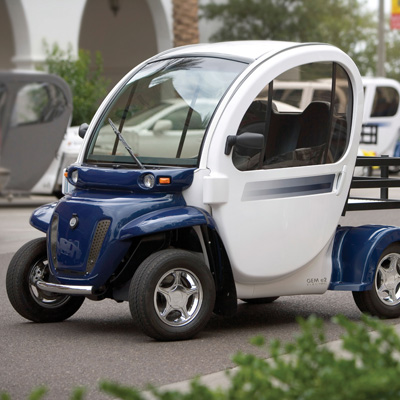 GEM<sup>&reg;</sup> e2 Electric Car - Economic and environmentally friendly, this two-passenger vehicle is ideal for the short trips you make every day. Six 12-volt flooded electrolyte batteries provide a range of up to 35 miles on a charge.
