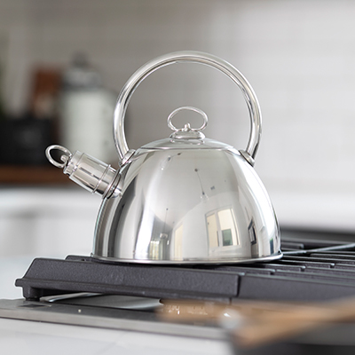 NORPRO<sup>&reg;</sup> Whistling Tea Kettle - Enjoy and serve comforting and delicious tea with this traditional styled whistling kettle. Stainless steel with heavy duty base, tight sealing lid, and removable whistling spout cover. Handwashing recommended. Capacity to hold 2.5 L.