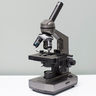 CARSON<sup>&reg;</sup> Biological Microscope - This intermediate level biological microscope is ideal for a high school or university student, hobbyist or technician.  Features include a 45° angle monocular head which can rotate 360°, coarse and fine line focus knobs, and LED illumination with intensity control.