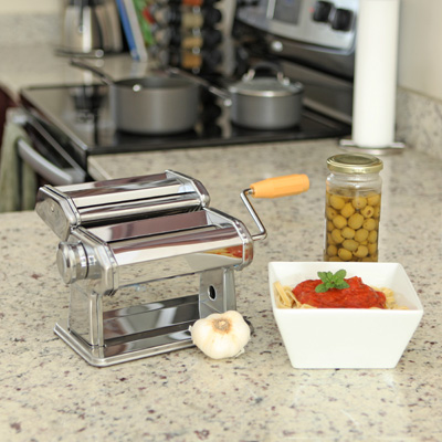 NORPRO<sup>&reg;</sup> Pasta Machine - Make fresh pasta at home with this chrome plated steel pasta machine, with nickel plated steel rollers.  Hand crank machine clamps securely to most any table or countertop to cut lasagna, fettucine and tagliolini pasta. Instruction booklet and recipes included.